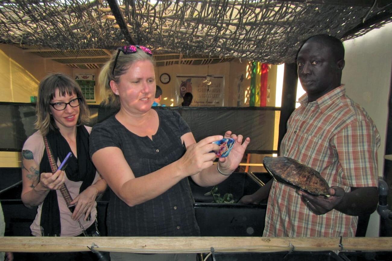 Tomas Diagne showing an African freshwater turtle at the African Chelonian Institute. © Lucy Keith-Diagne