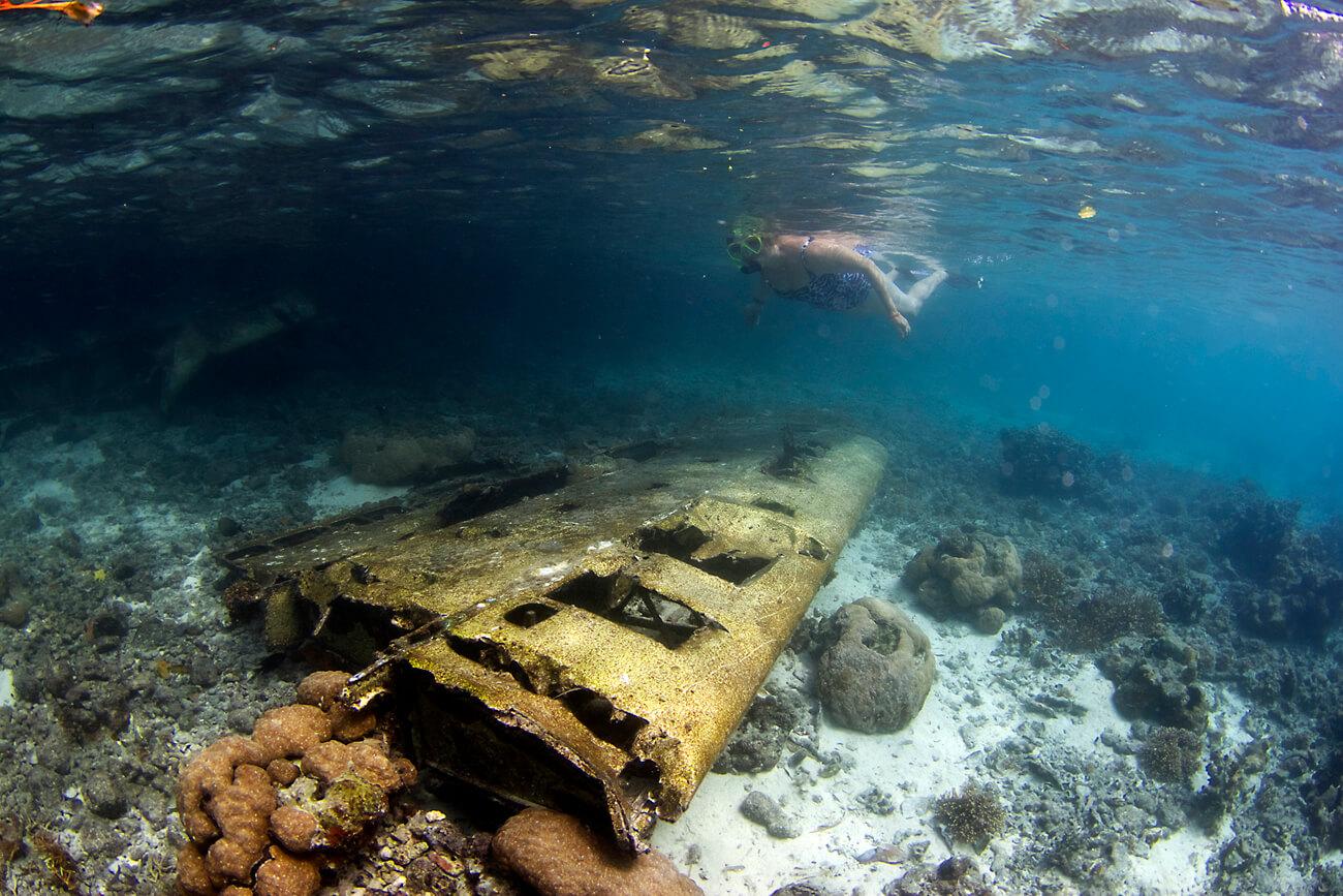 Exploring the wreck of a Japanese Zero aircraft from WWII. © Keoki Stender