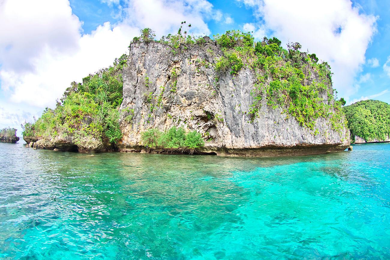 The Rock Islands offer dramatic landscapes while above water. © Keoki Stender